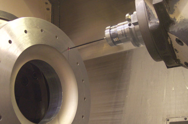 Turret-mounted probe on Mazak Integrex setting the coordinate system by finding the position of a pre-drilled hole